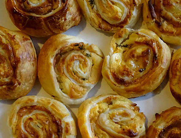 Puff pastry pinwheels with goat cheese, thyme and honey
