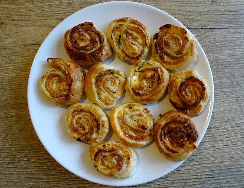 The finished pinwheels are golden brown. They look crispy and delicious.