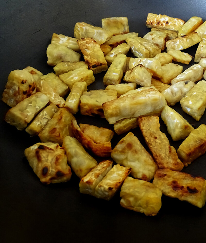 The tempeh is chopped into thick fingers.