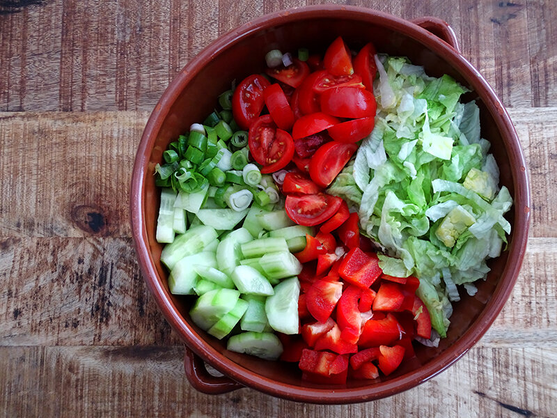 The colours of the vegetables are bright green and scarlett.
